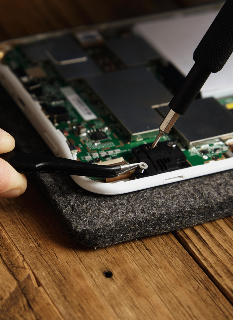 Apple device undergoing professional hardware repair at TeknoTronik